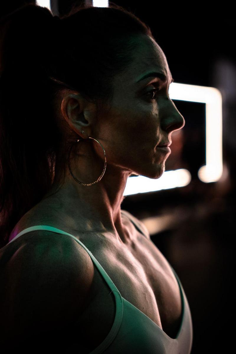 Low-key profile of a female athlete with a hoop earring